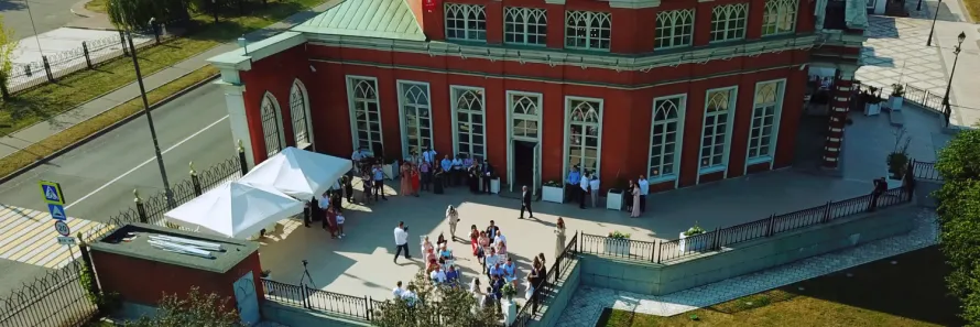 A luxury Mercedes S-Class wedding car arriving at the grand entrance of Bron Eifion Country House Hotel in North Wales for a bridal service.