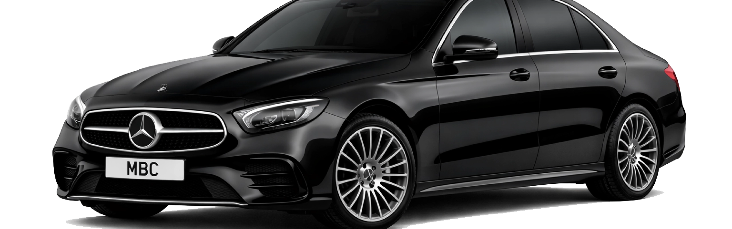 An executive relocation chauffeur greeting a client at Manchester Airport, facilitating smooth transitions into the North West with luxury luggage handling.
