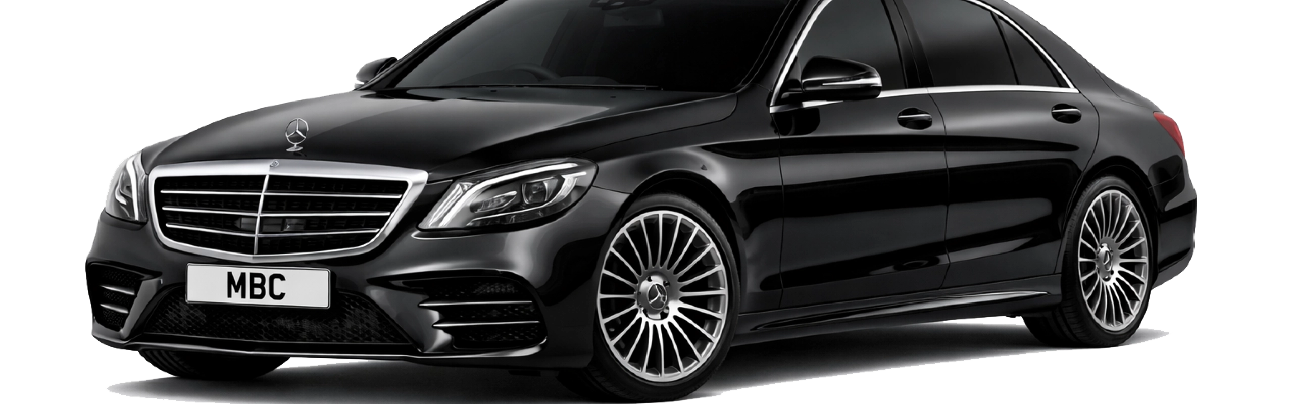 A luxury chauffeur vehicle parked by a scenic lake, representing a bespoke Lake District chauffeur tour departing from Manchester with a professional driver