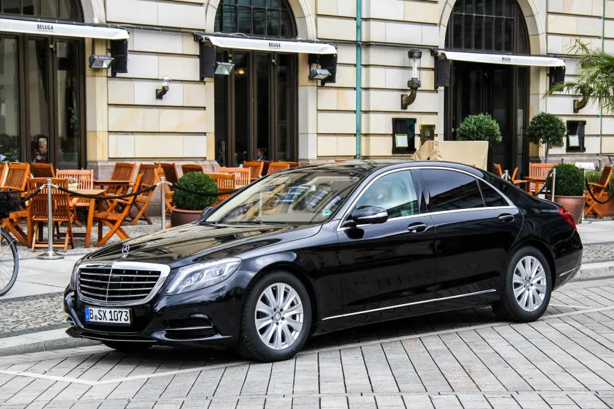 A luxury Mercedes-Benz V-Class chauffeur car parked outside the Brentwood Centre, providing executive transport for fans of the Snooker Home Nations Series.