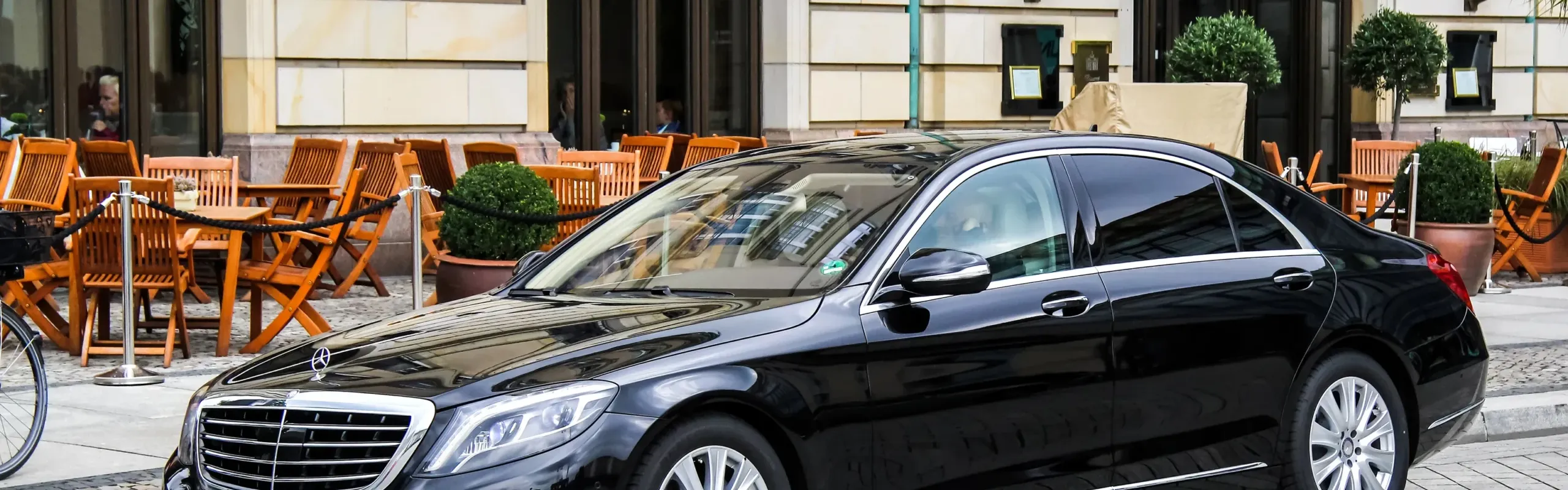 A luxury Mercedes-Benz V-Class chauffeur car parked outside the Brentwood Centre, providing executive transport for fans of the Snooker Home Nations Series.
