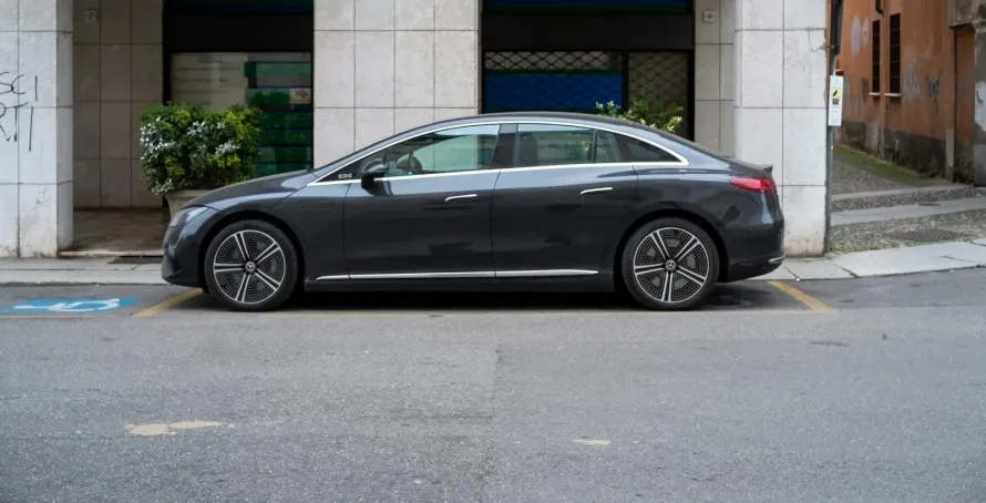 Interior of the Mercedes-Benz EQS (2024) chauffeur Manchester vehicle showing the electric executive cabin with leather seating and advanced MBUX technology