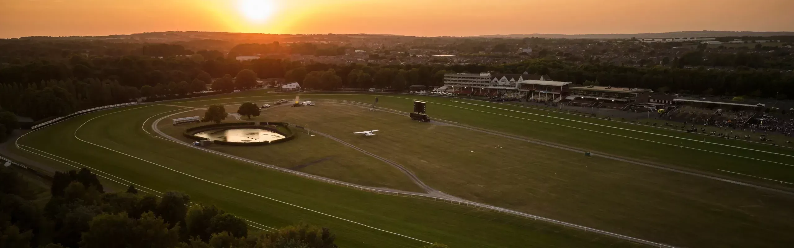 A luxury Mercedes S-Class providing a premium chauffeur service for the Haydock Races Grand National Trial at Haydock Park racecourse.