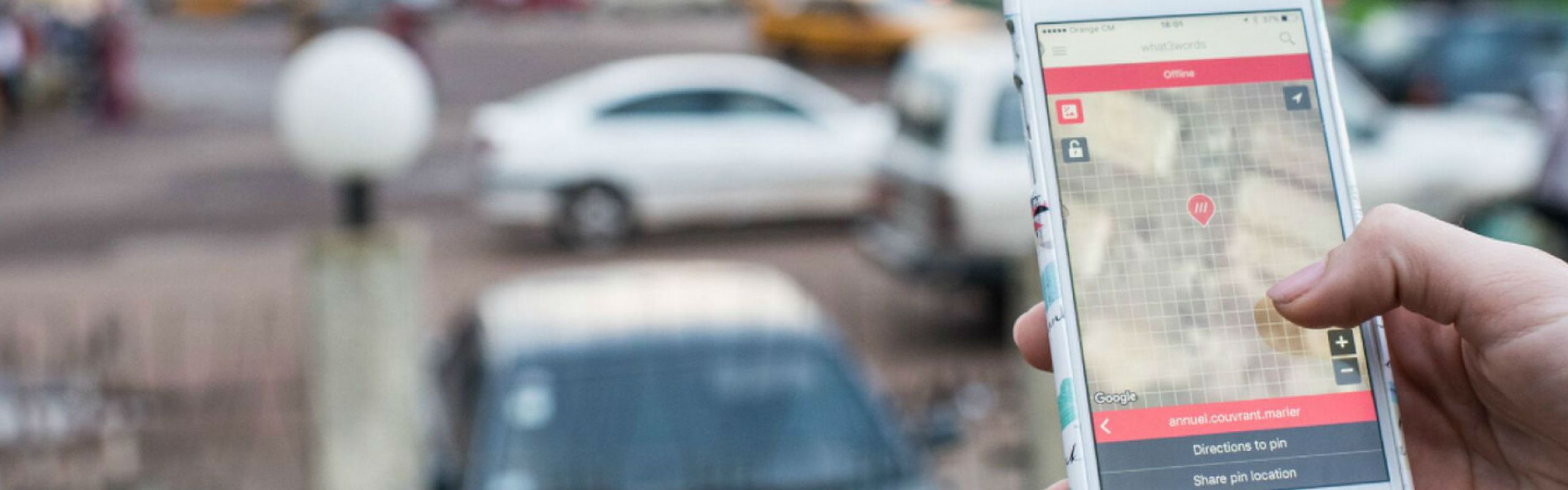 Precision pickup using What3Words technology with a luxury Manner Borne chauffeur vehicle at a specific Manchester location.